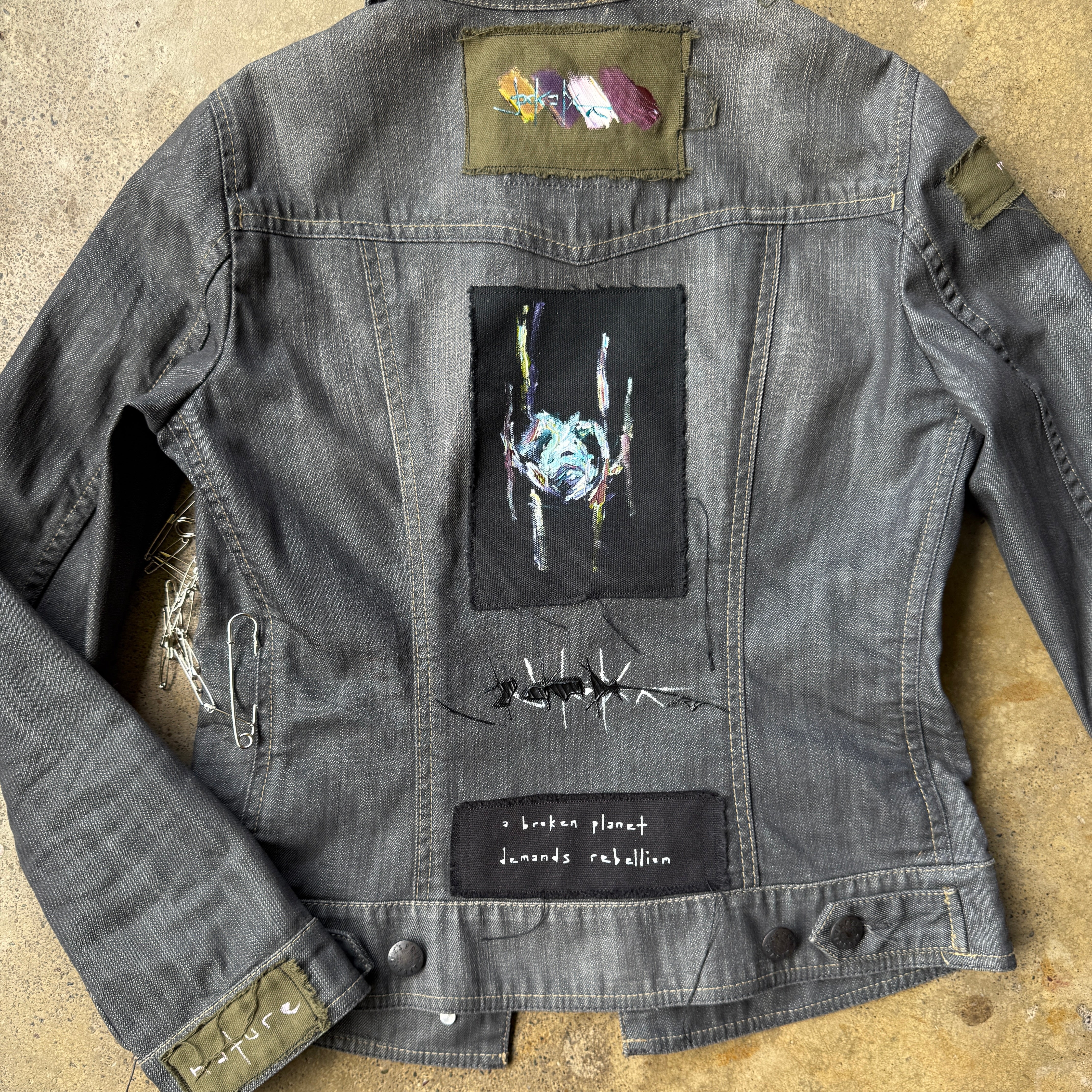 Upcycled Black Denim Jacket hand embellished by the artist Jay Jackal