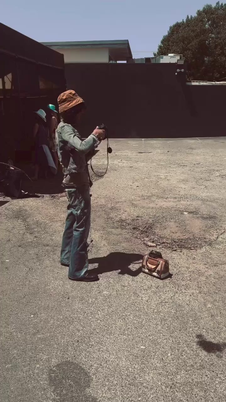 group of people in a car park modelling Jay Jackal human made streetwear